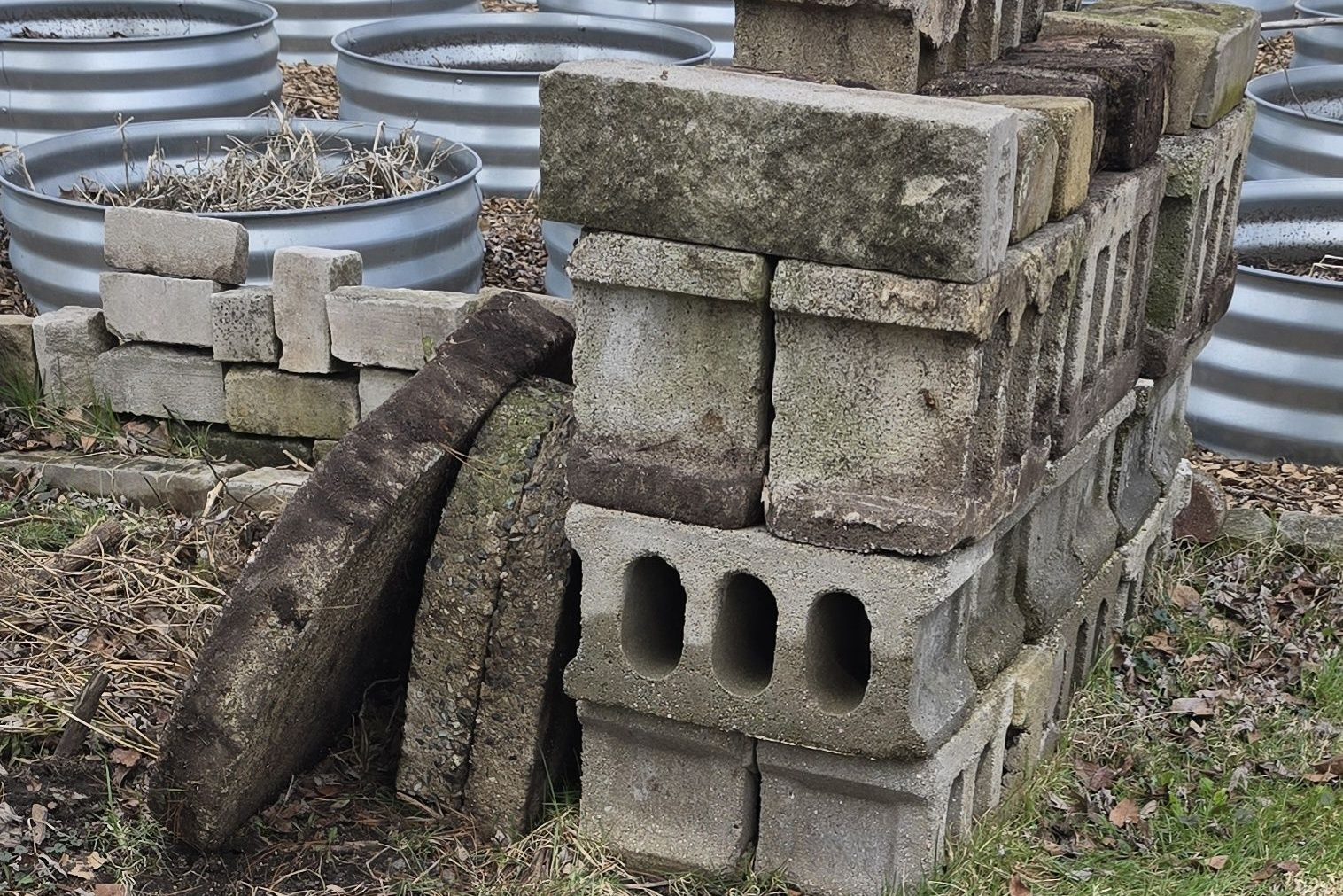 Incredibly heavy paving stones and cinder blocks that were buried and entwined in the ivy.